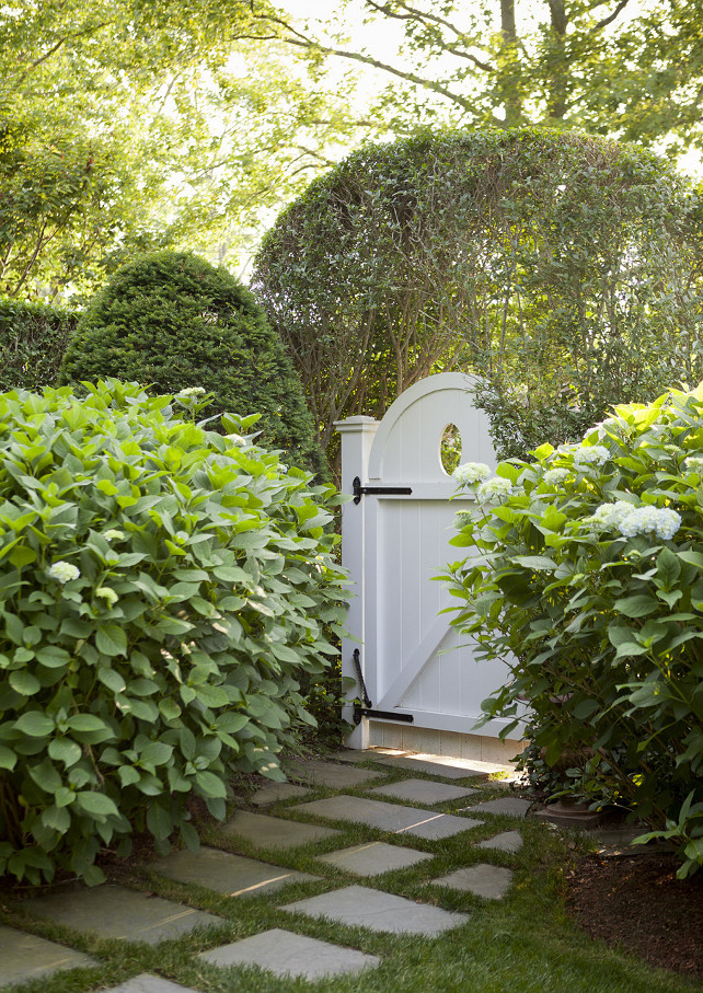 Garden-Gate.-White-garden-gate-surrounded-by-hedges-and-mature-landscaping.-Gate-Garden-Landscaping-Emily-Gilbert-Photography.